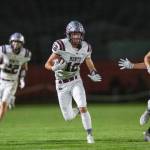 PHOTO BY FOREST WORGUM Montesano defensive back Toren Crites (12) returns an interception late in the first half during the Bulldogs 35-7 win on Thursday at Castle Rock High School.
