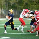 RYAN SPARKS | THE DAILY WORLD Aberdeen running back Aidan Watkins, left, sprints around the edge for a big gain in the first quarter of a 27-25 victory over Prosser on Friday in Aberdeen.