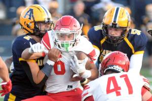 RYAN SPARKS | THE DAILY WORLD
Aberdeen linebackers Marcus Hale (2) and Nolan Cook corral Prosser running back Erik Delgado during the Bobcats' 27-25 win on Friday at Stewart Field in Aberdeen.
