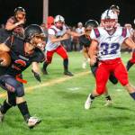 JARED WENZELBURGER | THE CHRONICLE Napavines Cael Stanley (2) evades Pe Ell-Willapa Valleys Blake Howard during a Friday evening game in Napavine.