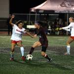 RYAN SPARKS | THE DAILY WORLD Montesano midfielder Bethanie Henderson dribbles against Teninos Paisley Garcia, left, during the Bulldogs 4-0 win in a 1A Evergreen League game on Tuesday in Montesano.