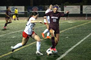 RYAN SPARKS | THE DAILY WORLD Montesano senior Mikayla Stanfield (10) possesses the ball against Tenino sophomore Kyra Dirks during the Bulldogs 4-0 victory on Tuesday in Montesano.