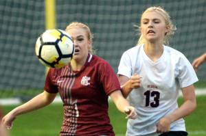RYAN SPARKS | THE DAILY WORLD Hoquiams Chloe Dietrick (1) and Ocostas Scarlett Nelson make a play on the ball during the Wildcats 1-0 win on Thursday at Olympic Stadium in Hoquiam.