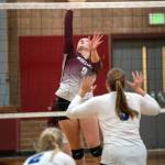 PHOTO BY FOREST WORGUM Montesano middle blocker Kylee Wisdom (9) goes up for a kill against Eatonville on Thursday at Montesano High School.