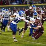 RYAN SPARKS | THE DAILY WORLD Elma running back Bo Muller (22) runs against Hoquiam defender Zander Jump (10) during the Eagles 41-7 victory on Friday in Hoquiam.