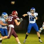 PHOTO BY FOREST WORGUM Elma quarterback Carter Studer (12) throws downfield during a 41-7 victory over Hoquiam on Friday at Olympic Stadium in Hoquiam.