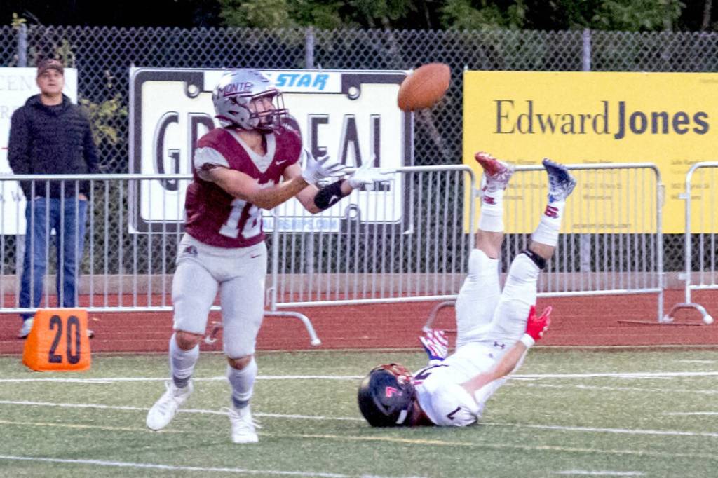 PHOTO BY SHAWN DONNELLY Montesano receiver Mason Rasmussen, left, hauls in a touchdown pass during a 55-0 win over Shelton on Friday at Montesano High School.