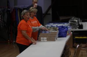 Michael S. Lockett / The Daily World
Volunteers set up a table of goods for veterans experiencing homelessness during a stand-down in Hoquiam on Oct. 2.
