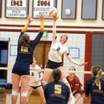 RYAN SPARKS | THE DAILY WORLD Hoquiam middle blocker Kristina Goulet (2) rises for a shot against Aberdeens Lilly Camp (12) during the Grizzlies 3-2 victory on Wednesday at Hoquiam Square Garden.