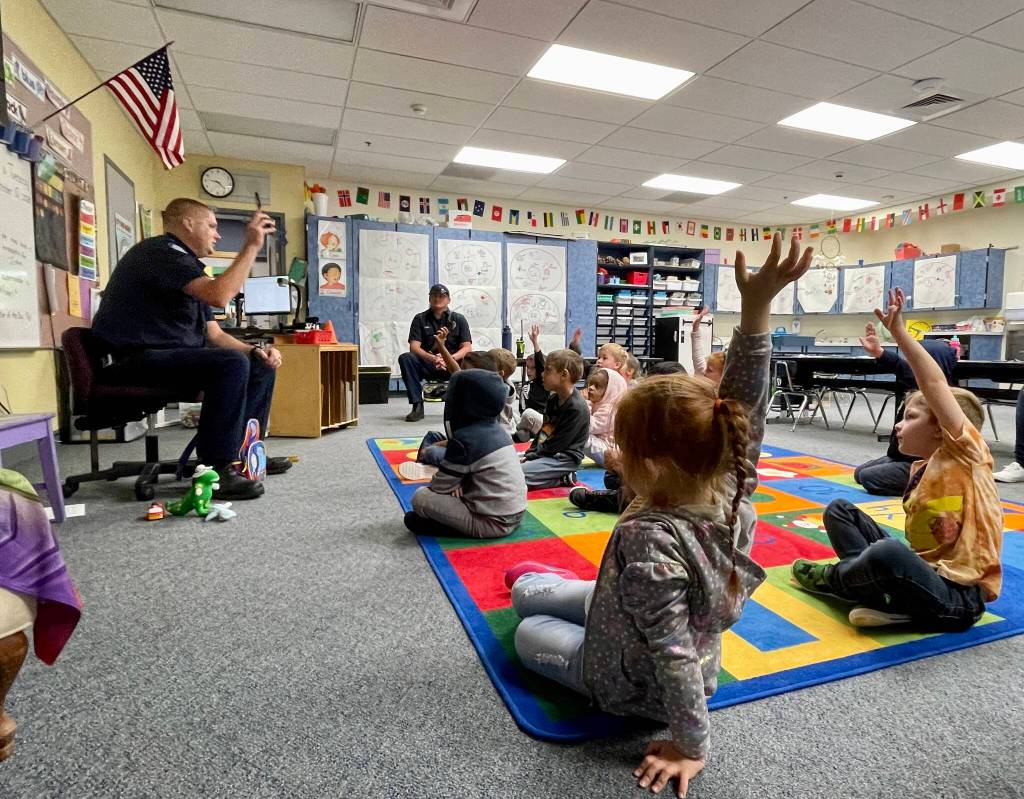Michael S. Lockett / The Daily World
Students interact with Aberdeen fire services specialist Mitch Housden at Robert Gray Elementary on Oct. 10 as part of Fire Prevention Week.
