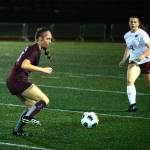 RYAN SPARKS | THE DAILY WORLD Montesano midfielder Hazel Jones, left, plays the ball while being defended by Hoquiams Maci Winkelman during the Bulldogs 14-0 win on Tuesday at Montesano High School.