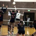 RYAN SPARKS / THE DAILY WORLD 
Hoquiams Hayden Brook-Andrew (5) puts up a drop shot against Montesanos Kalia Hatton (10) and Jillie Dalan (12) during a 3-1 loss on Tuesday at Montesano High School.