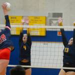 RYAN SPARKS | THE DAILY WORLD Aberdeens Claire Mottinger (4) and Alyvia Lamont (13) attempt to block the shot of Black Hills Ashley Harris during a straight-set loss on Thursday in Aberdeen.
