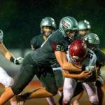 PHOTO BY FOREST WORGUM Montesano defenders Cam Taylor (50) and Peyton Damasiewicz (52) wrap up Hoquiam running back Dominic Standstipher during the Bulldogs 57-0 win on Friday at Jack Rottle Field in Montesano.