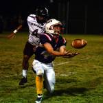 RYAN SPARKS | THE DAILY WORLD Pe Ell-Willapa Valley receiver Spud Swogger (44) makes a catch against Raymond-South Bend defensive back Christopher Quintana during the Titans 14-12 win Friday at Crogstad Field in Menlo.