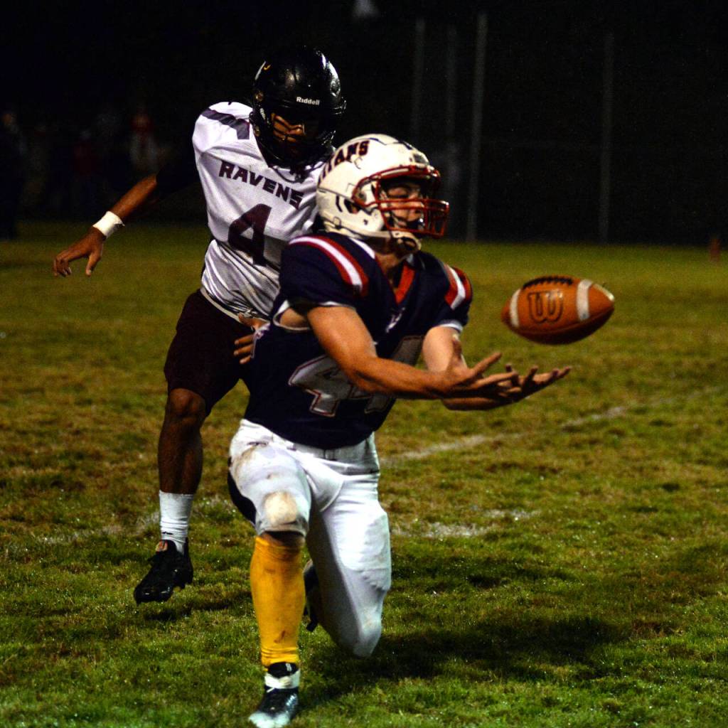 RYAN SPARKS | THE DAILY WORLD Pe Ell-Willapa Valley receiver Spud Swogger (44) makes a catch against Raymond-South Bend defensive back Christopher Quintana during the Titans 14-12 win Friday at Crogstad Field in Menlo.