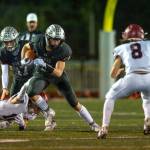 PHOTO BY FOREST WORGUM Montesano senior running back Gabe Bodwell (44) carries the football while Hoquiam defensive back Kingston Case (8) defends during the Bulldogs 57-0 win on Friday at Montesano High School.