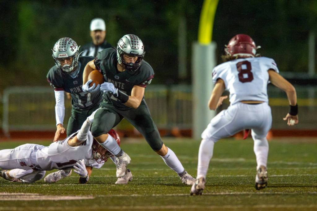 PHOTO BY FOREST WORGUM Montesano senior running back Gabe Bodwell (44) carries the football while Hoquiam defensive back Kingston Case (8) defends during the Bulldogs 57-0 win on Friday at Montesano High School.