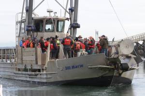 Michael S. Lockett / The Daily World
Members of the Marine Resource Committee go out to see crews collecting European green crab near Westport on Oct. 13, 2023.