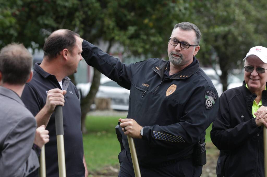 Cosmpolis Police Chief Heath Layman points at where the police used to operate out of a trailer during the groundbreaking ceremony for a new municipal building on Oct. 13. (Michael S. Lockett / The Daily World)