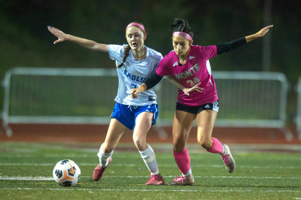 PHOTO BY FOREST WORGUM Elmas Valerie Echeverria, left, and Montesanos Dekotah Parks jockey for possession during the Eagles 1-0 win over the Bulldogs on Thursday in Montesano.