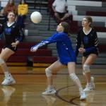 RYAN SPARKS | THE DAILY WORLD Elma junior libero Allyson Warren, middle, receives a serve during a straight-set loss to Montesano on Thursday at Montesano High School.