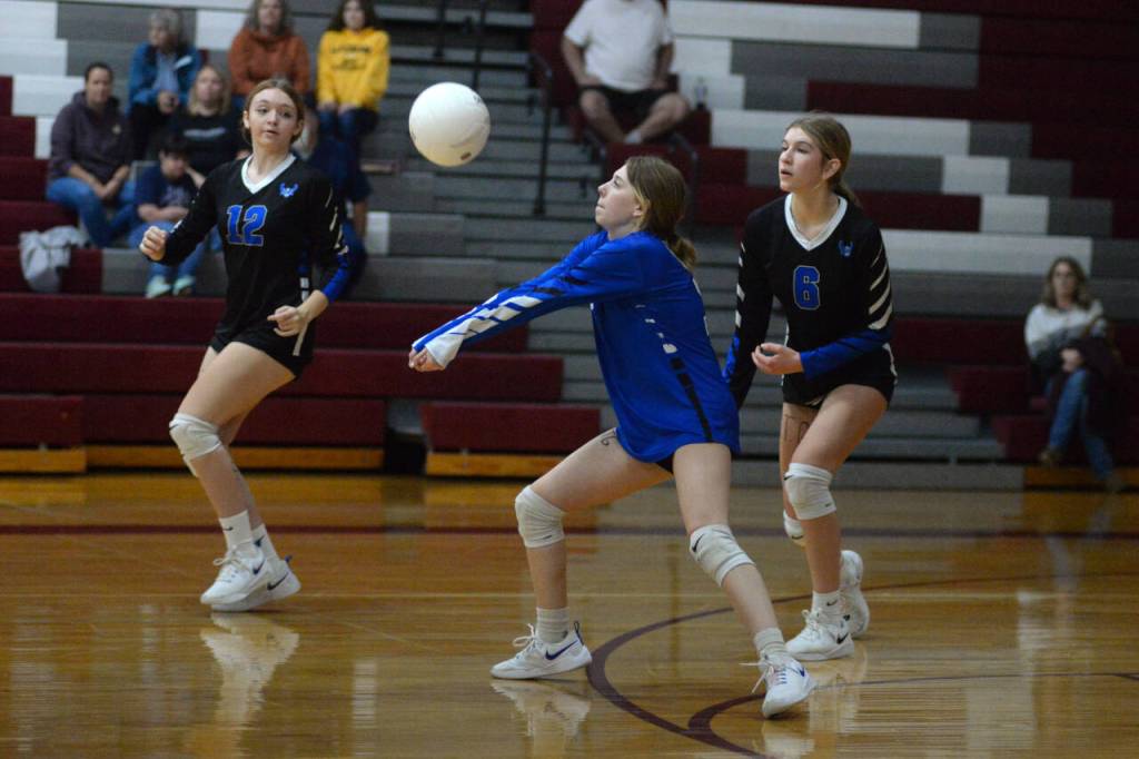 RYAN SPARKS | THE DAILY WORLD Elma junior libero Allyson Warren, middle, receives a serve during a straight-set loss to Montesano on Thursday at Montesano High School.