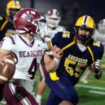 RYAN SPARKS | THE DAILY WORLD Montesano defender Paul Baltazar (55) chases W.F. West quarterback Gage Brumfield during a game on Friday at Stewart Field in Aberdeen.