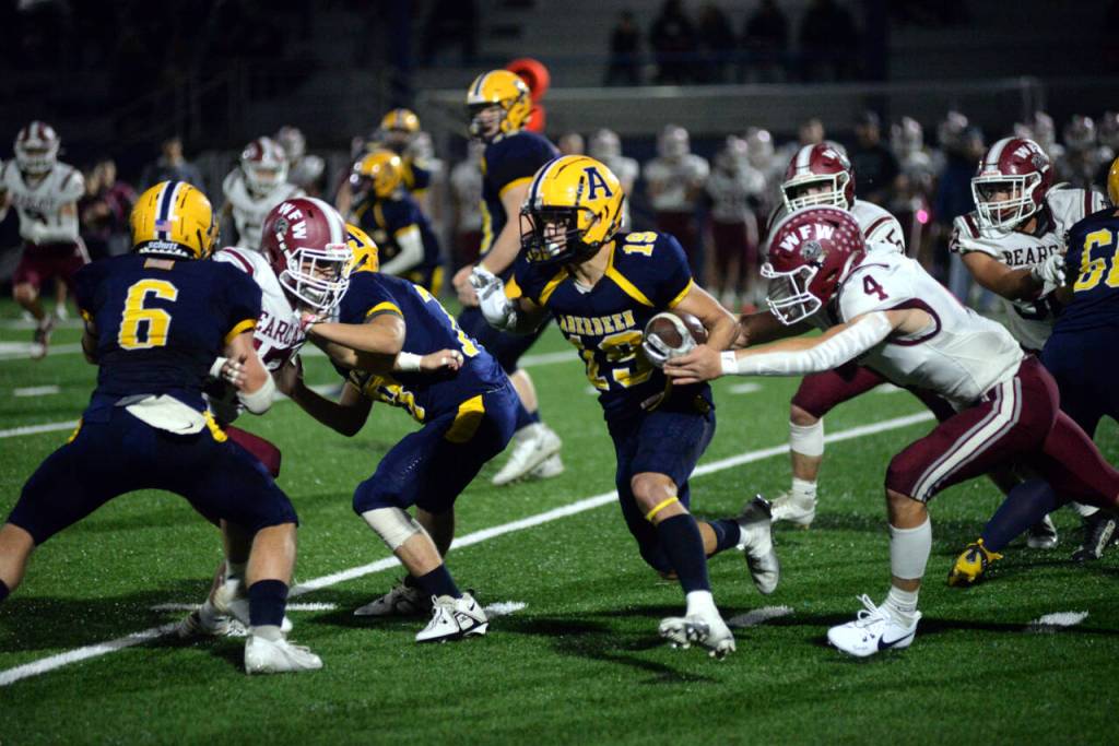 RYAN SPARKS | THE DAILY WORLD Aberdeen running back Aidan Watkins (19) outruns W.F. West linebacker Gage Brumfield (4) during the Bobcats 41-14 loss on Friday at Stewart Field in Aberdeen.