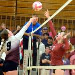 RYAN SPARKS | THE DAILY WORLD Montesano junior Kylee Wisdom (9) and Hoquiam senior Kristina Goulet (2) compete for a ball at the net during the Bulldogs 3-1 win on Thursday at Hoquiam Square Garden.