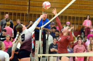 RYAN SPARKS | THE DAILY WORLD Montesano junior Kylee Wisdom (9) and Hoquiam senior Kristina Goulet (2) compete for a ball at the net during the Bulldogs 3-1 win on Thursday at Hoquiam Square Garden.
