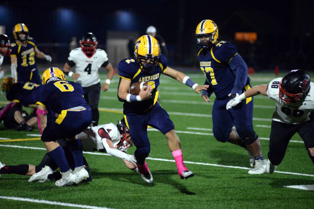 RYAN SPARKS | THE DAILY WORLD Aberdeen senior Marcus Hale (2) breaks a tackle during a run in the Bobcats 26-19 win over Shelton on Friday in Aberdeen.
