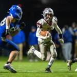 PHOTO BY FOREST WORGUM Montesanos Terek Gunter carries the ball during the Bulldogs 49-0 win over Elma on Friday at Davis Field in Elma.