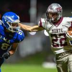 PHOTO BY FOREST WORGUM Montesanos Bode Poler (22) carries the ball while Elmas Traden Carter (88) defends during the Bulldogs 49-0 win on Friday at Davis Field in Elma.