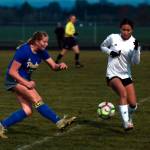 DYLAN WILHELM | THE CHRONICLE Raymond-South Bends Megan Kongbouakhay (1) defends against Adnas Margarite Humphrey during the Ravens 2-1 loss in the first round of the 2B District 4 Tournament on Monday in Adna.