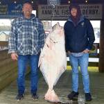 The Daily World file photo
Ty and Pat Haskew pose with a 66.65-pound halibut slab during the Westport Charter Boat Association halibut derby in 2021.