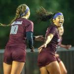 PHOTO BY FOREST WORGUM Montesano forward Jaelyn Butterfield, right, is congratulated by senior Mikayla Stanfield (10) during the Bulldogs 3-2 win over Seton Catholic in the 1A District 4 semifinals on Thursday in Montesano.