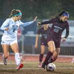 PHOTO BY FOREST WORGUM Montesano midfielder Bethanie Henderson (22) dribbles against Seton Catholics Alyssa Mancuso during the Bulldogs 3-2 victory in the 1A District 4 semifinals on Thursday in Montesano.