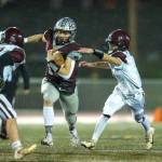 PHOTO BY FOREST WORGUM 
Montesanos Felix Romero, left, eludes the grasp of a Stevenson defender during a 71-0 win in a 1A crossover playoff game on Friday in Montesano.