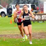 SUBMITTED PHOTO Hoquiams Jane Roloff, left, pursues Port Townsends Aaliyah Cassidy Yearian during the 1A State Championship girls cross country race on Saturday at the Sun Willows Golf Course in Pasco. Roloff would win the state title with a time of 18:28.00.