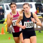 SUBMITTED PHOTO Hoquiams Jane Roloff, left, pursues Port Townsends Aaliyah Cassidy Yearian during the 1A State Championship girls cross country race on Saturday at the Sun Willows Golf Course in Pasco. Roloff would win the state title with a time of 18:28.00.