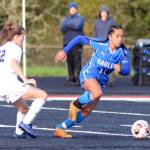 RYAN SPARKS | THE DAILY WORLD Elma midfielder Eliza Sibbett (11) gains possession against Seton Catholics Lydia Hawkinson during the 1A District 4 third-place game on Saturday in Tenino. Elma would go on to lose in a penalty-kick shootout, ending its season.