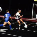 RYAN SPARKS | THE DAILY WORLD Montesanos Alexa Stanfield, middle, sends the ball forward while under pressure from La Centers Bailey McIntosh (3) during the Bulldogs 3-0 loss in the 1A District 4 Championship game on Saturday in Tenino.