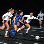 RYAN SPARKS | THE DAILY WORLD La Centers Shaela Bradley, middle, is pursued by Montesanos Bethanie Henderson, right, and Izzabelle Taylor during the Bulldogs 3-0 loss in the 1A District 4 Championship game on Saturday at Tenino High School.