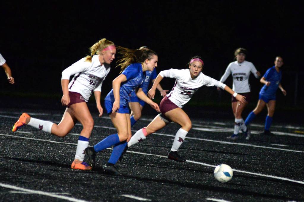 RYAN SPARKS | THE DAILY WORLD La Centers Shaela Bradley, middle, is pursued by Montesanos Bethanie Henderson, right, and Izzabelle Taylor during the Bulldogs 3-0 loss in the 1A District 4 Championship game on Saturday at Tenino High School.