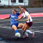 RYAN SPARKS | THE DAILY WORLD Montesanos Adda Potts, right, and battles for possession with La Centers Lauren Baker during the Bulldogs 3-0 loss in the 1A District 4 Championship game on Saturday in Tenino.