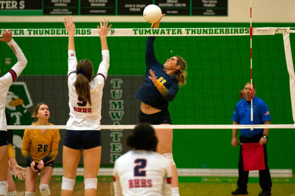 JOSH KIRSHENBAUM | THE CHRONICLE Aberdeen Annika Hollingsworth sends a ball over the net during a four-set loss to Black Hills in a loser-out match at the 2A District 4 Tournament on Saturday in Tumwater.
