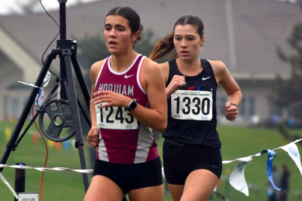 SUBMITTED PHOTO Hoquiams Jane Roloff (1243) leads Port Townsends Aaliyah Yearian during the 1A State Championship girls cross-country race on Saturday at the Sun Willows Golf Course in Pasco.