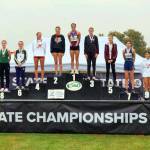 SUBMITTED PHOTO Hoquiams Jane Roloff (1) stands atop the podium after winning the state title at the 1A State Championship girls cross-country meet on Saturday at the Sun Willows Golf Course in Pasco.