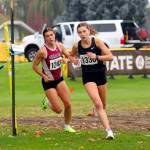 SUBMITTED PHOTO Hoquiam senior Jane Roloff, left, keeps pace with Port Townsends Aaliyah Yearian during the 1A State Championship girls cross-country race on Saturday at the Sun Willows Golf Course in Pasco.